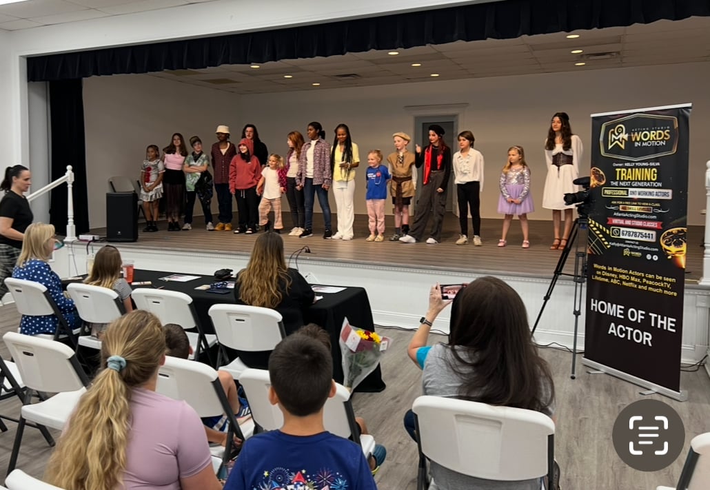 Young actors performing for families during a Words In Motion community program